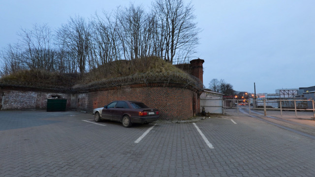 Behind the shopping center