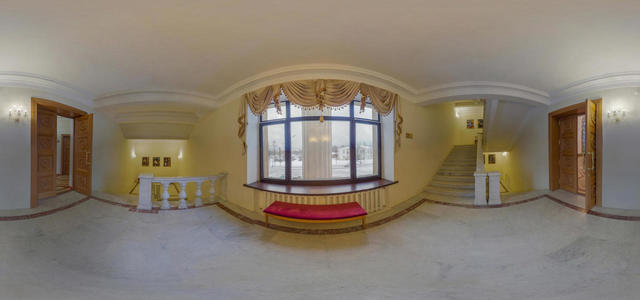 Staircase in front of the mirrored hall