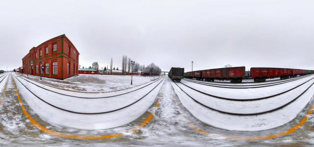 The station is a view from the railroad tracks.