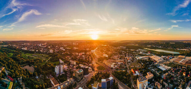 aerial-drone-view-chisinau-downtown-panorama-view-multiple-buildings-roads-park-with-lush