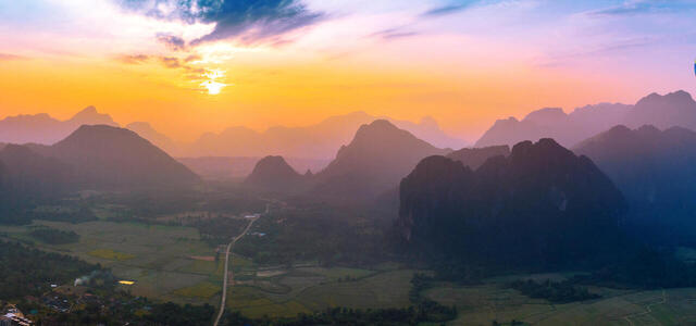 aerial-view-vang-vieng-with-mountains-balloon-sunset