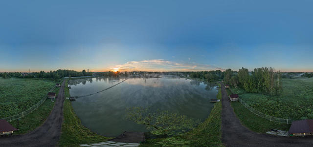 Sunrise on foggy ponds